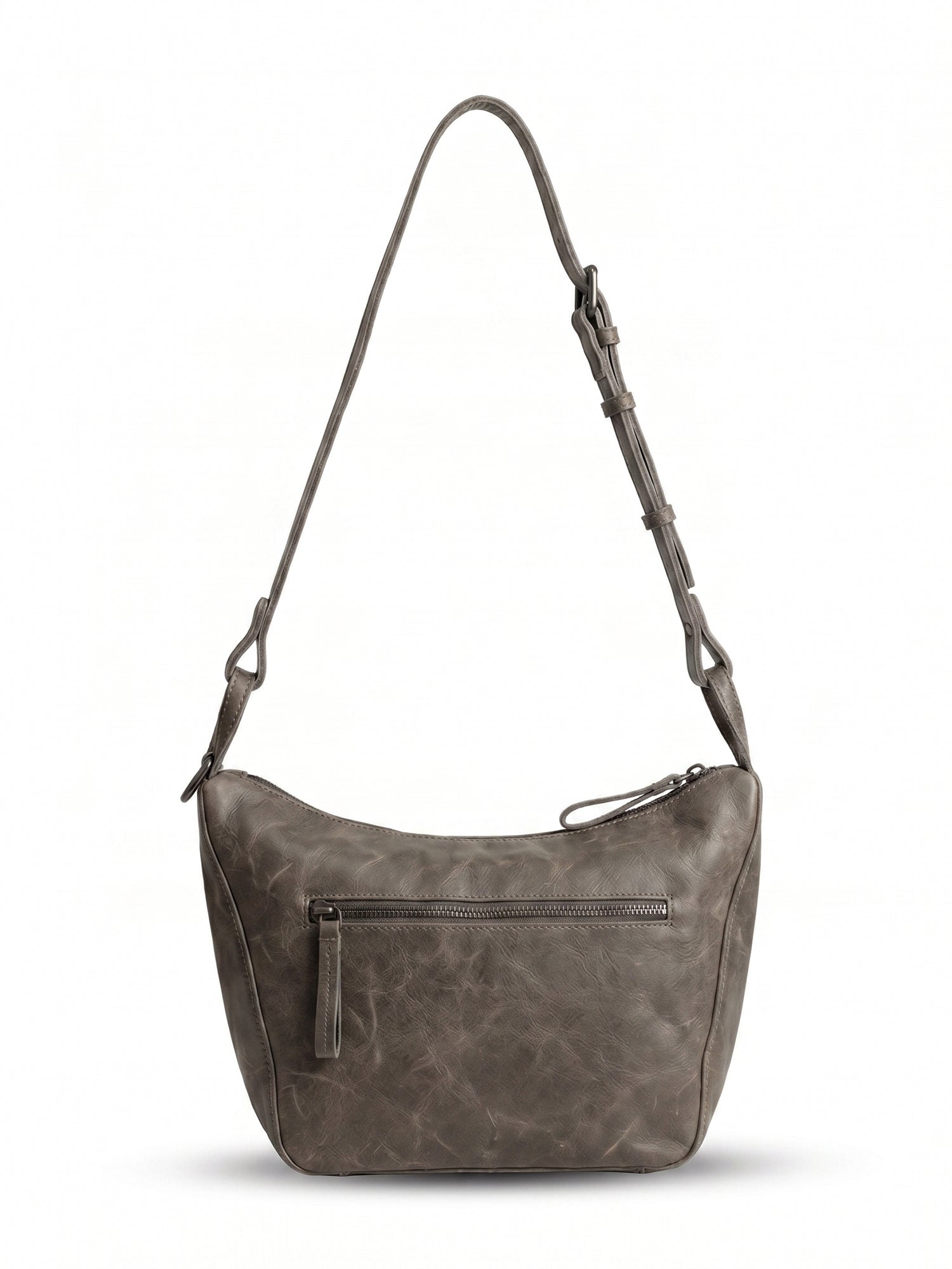 Leather evening bag with a thin strap and a dark brown ring