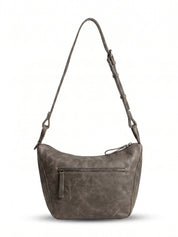 Leather evening bag with a thin strap and a dark brown ring