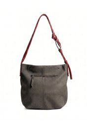 Red leather bag with a tie-on strap