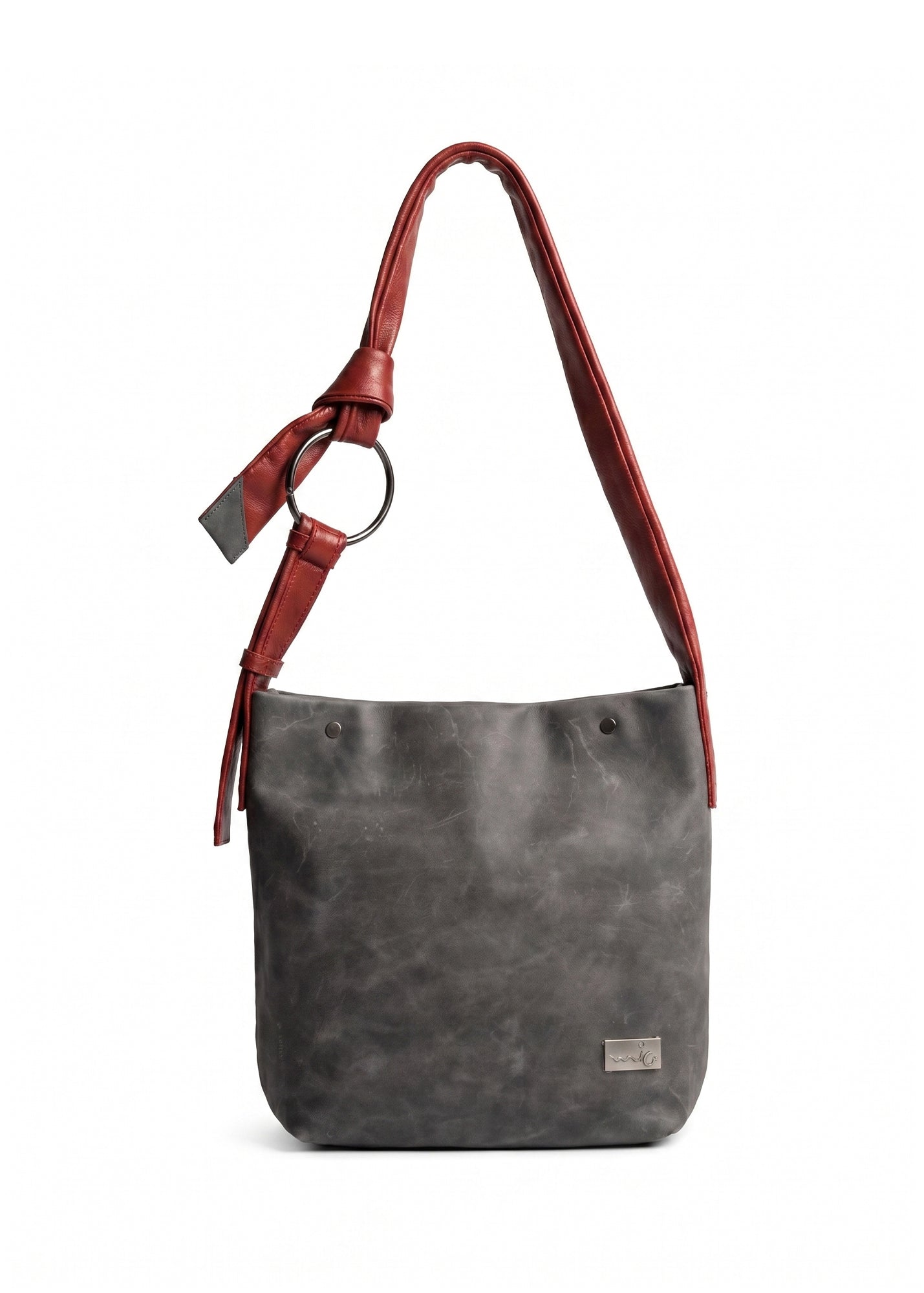 Red leather bag with a tie-on strap