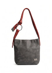 Red leather bag with a tie-on strap