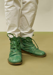 Women's boots with leather lacing and green zipper