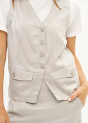 Vest with diagonal pockets and tie-back in grey