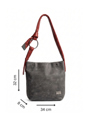 Red leather bag with a tie-on strap
