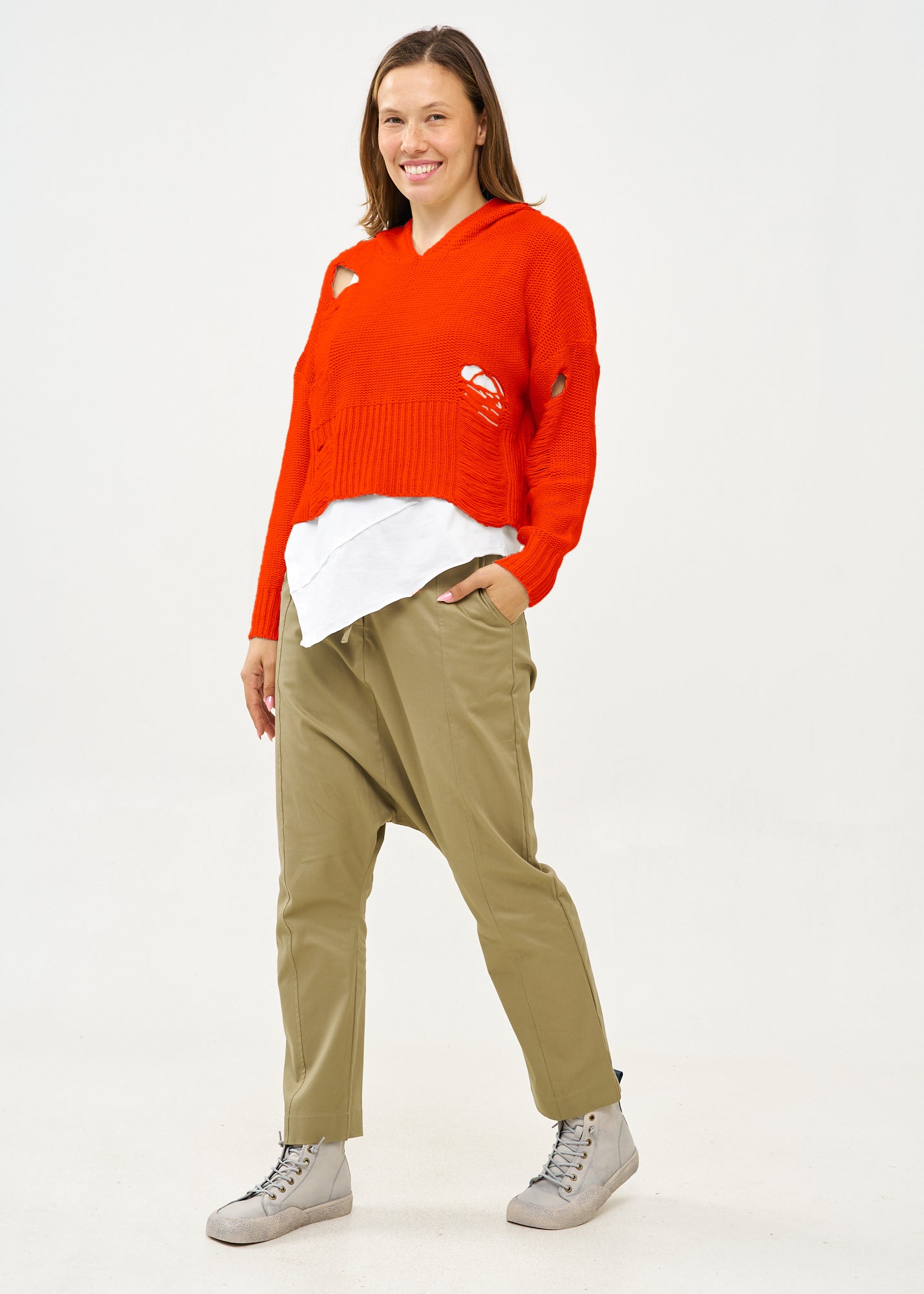 Knitwear with orange braid extension cap