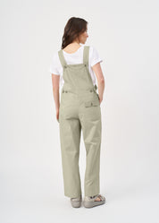 Suspender jumpsuit with green ribbon