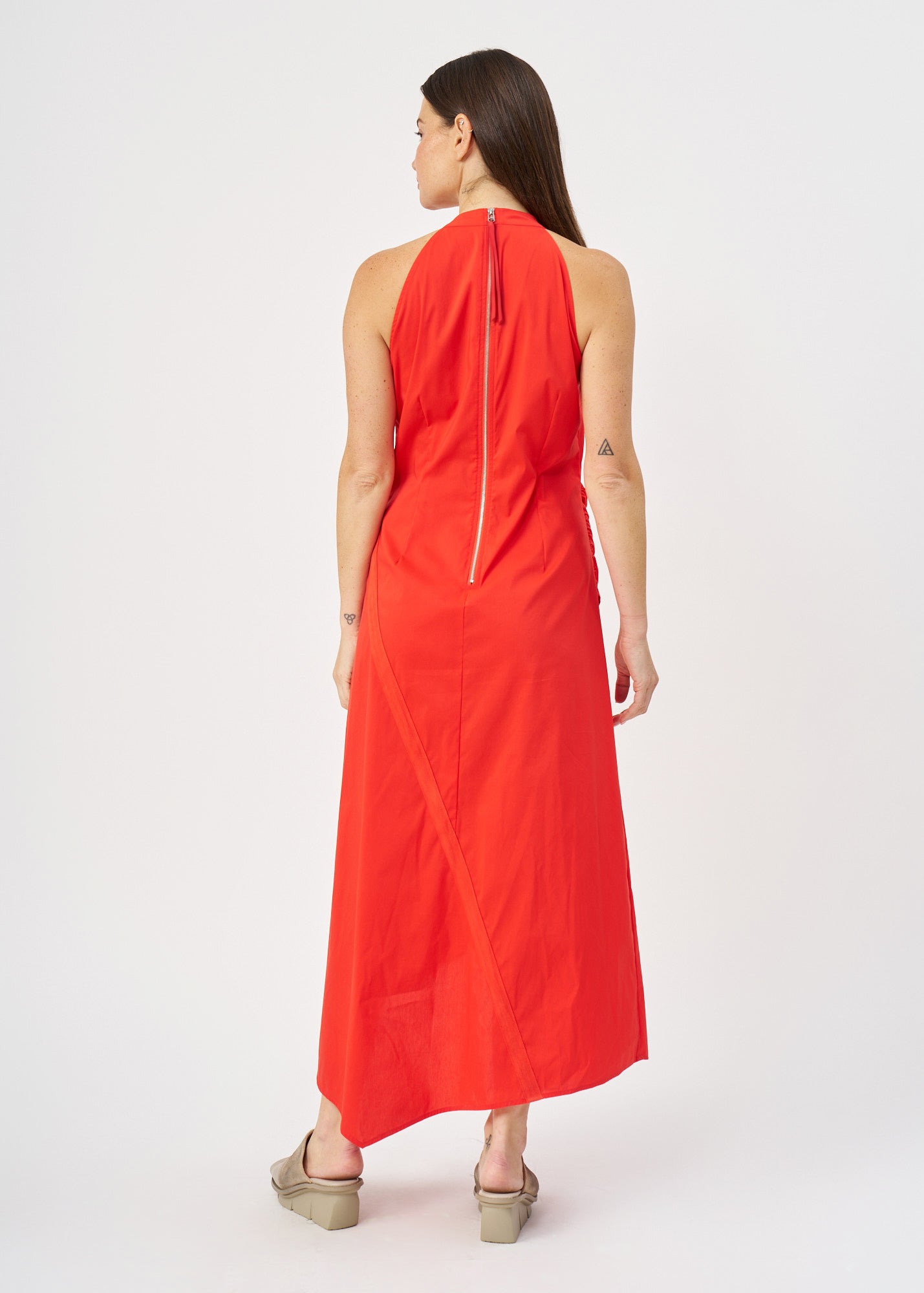 Halter neck dress with gathers and a red ribbon