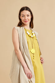 A necklace of large yellow dotted beads
