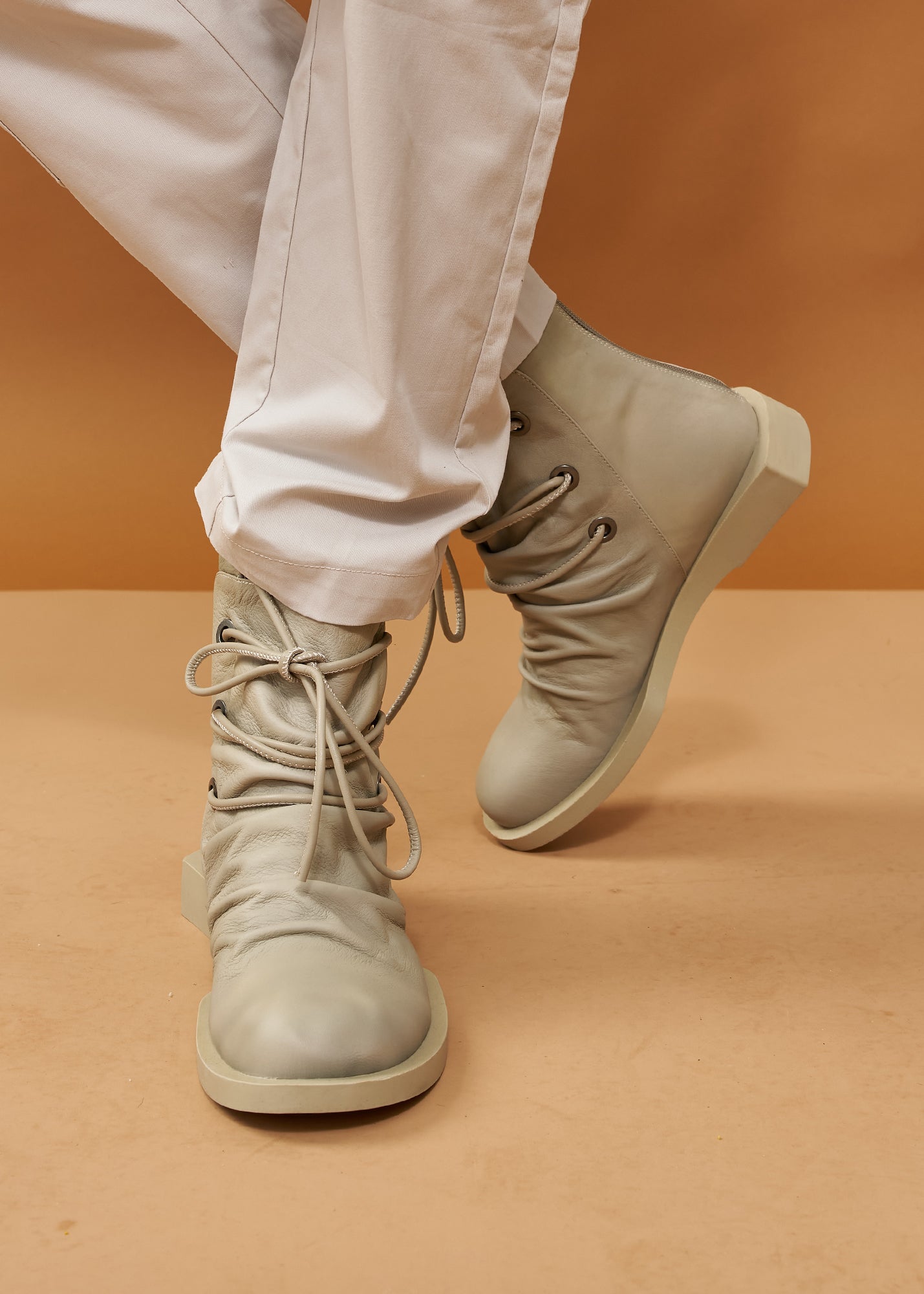 Women's boots with leather lacing and gray zipper