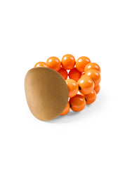 A bracelet with wooden beads and a white disk