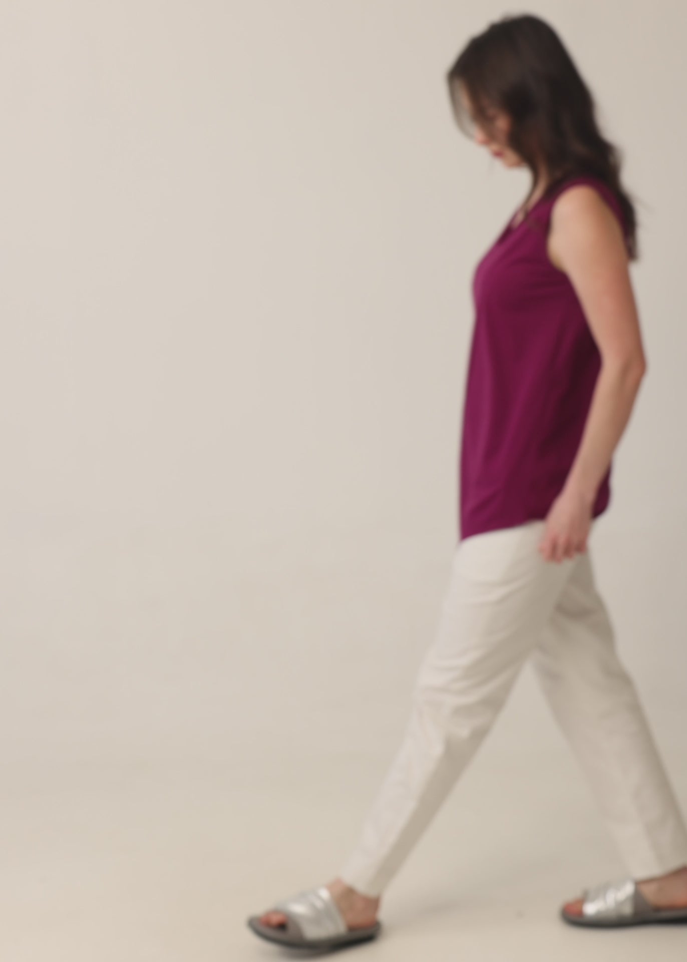 V-neck tank top with diagonal stitching and stone accents