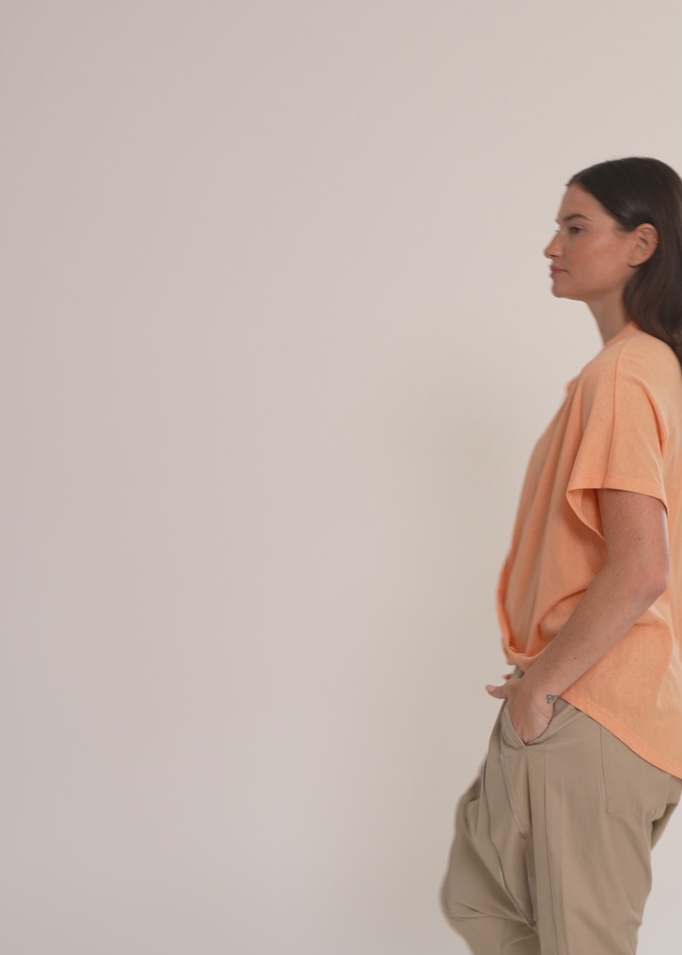 Green button-down shirt with a twisted hem