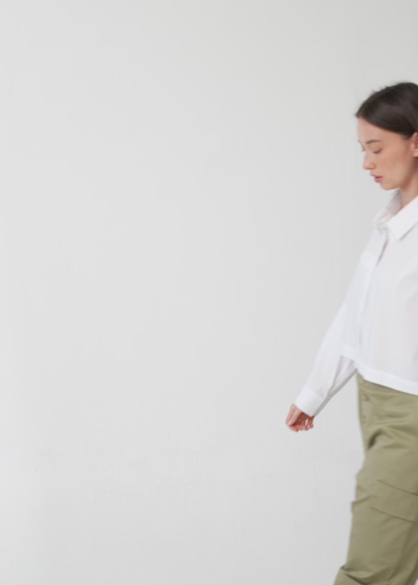Black button-down shirt with long shoulder straps