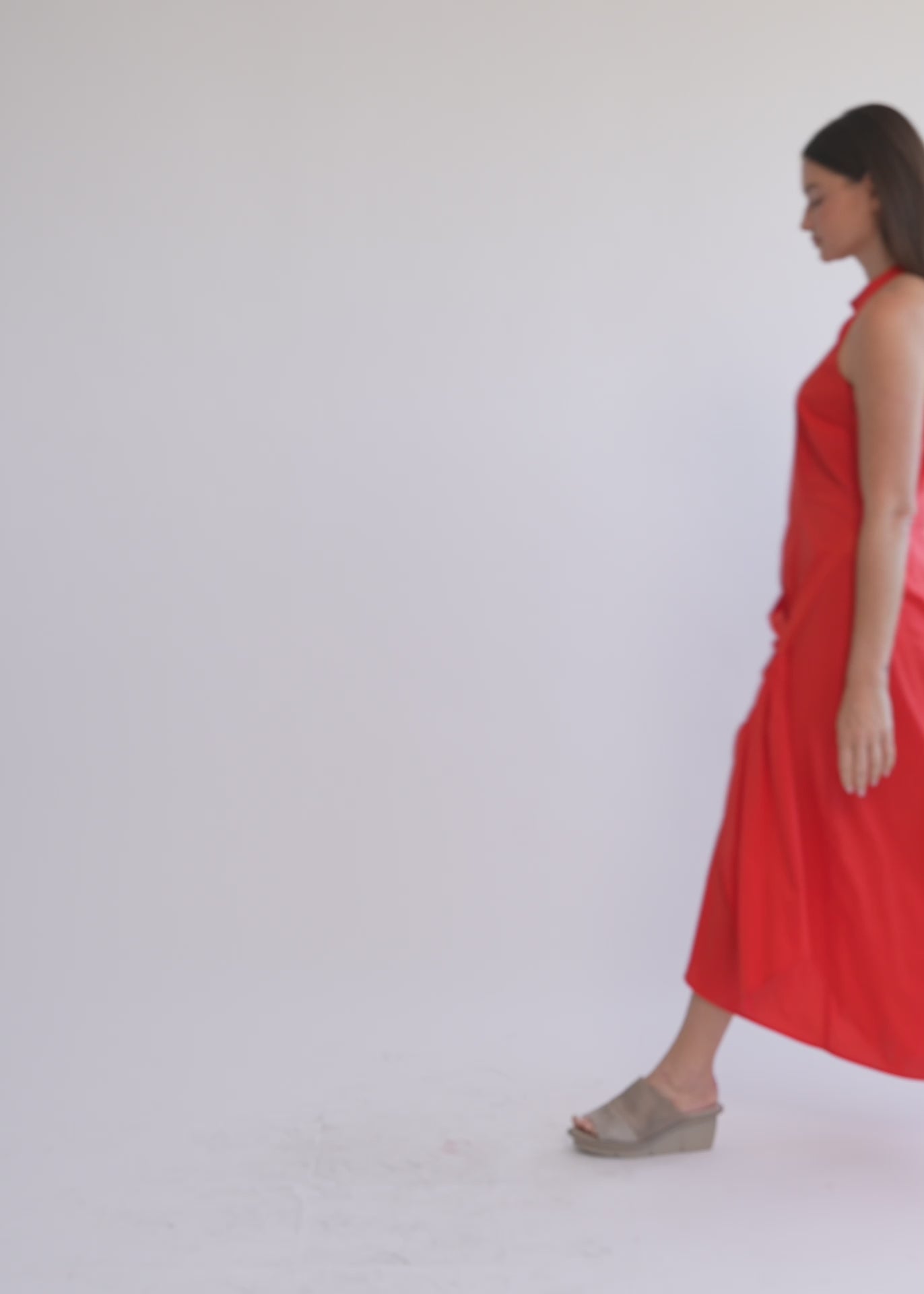 Halter neck dress with gathers and a black ribbon