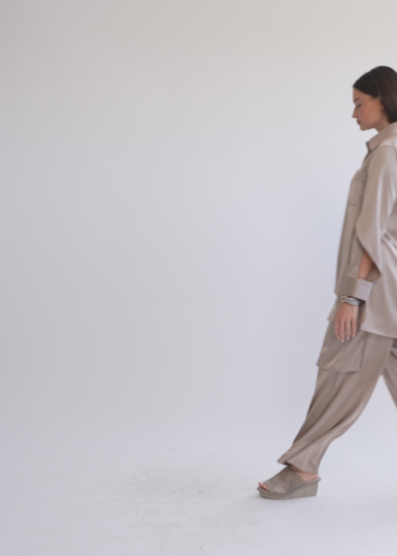 Brown satin button-down shirt with open sleeves