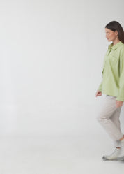 Green button-down shirt with diagonal hem and pocket
