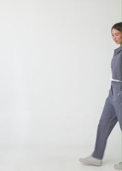 Long pants with brown diagonal belt